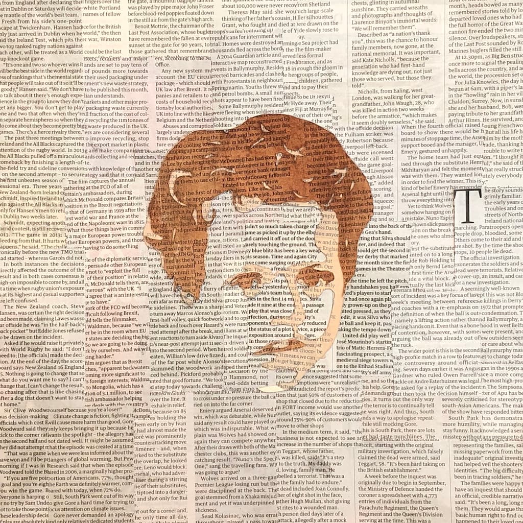 Layered watercolor portrait of a boy on collaged paper